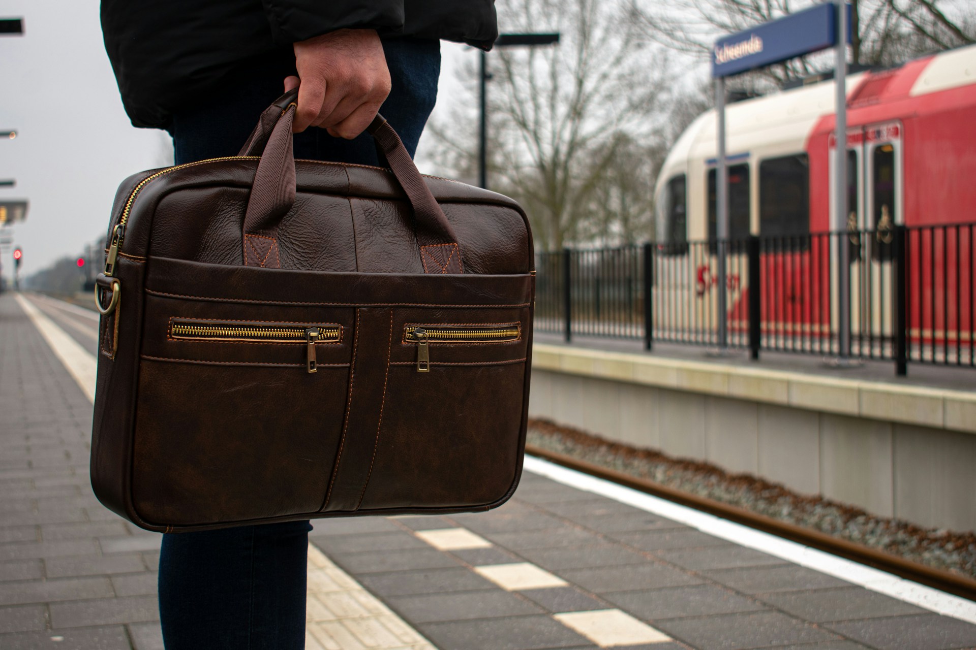 A man holding a laptop bag