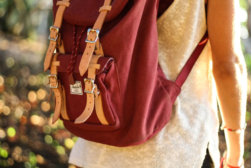 Woman wearing red backpack