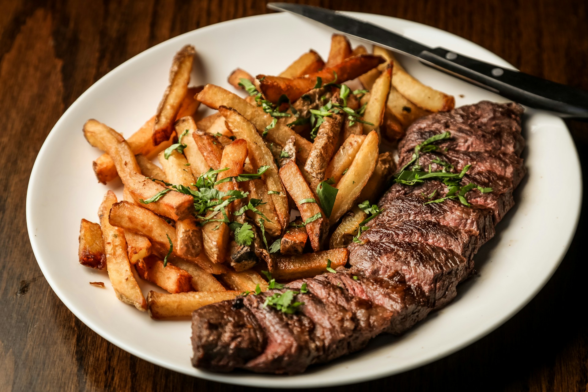 grilled steak on white ceramic plate