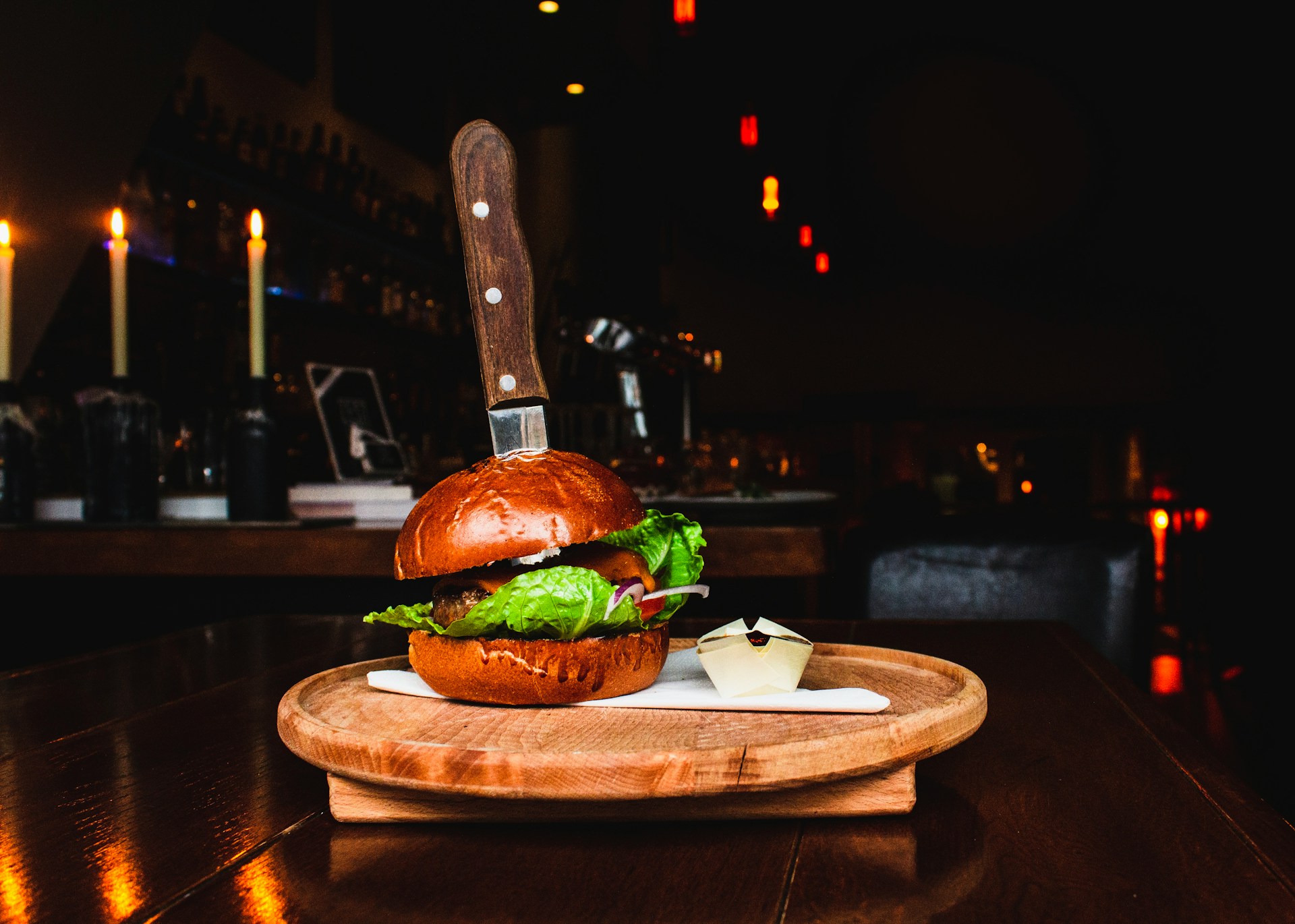 burger on brown wooden tray