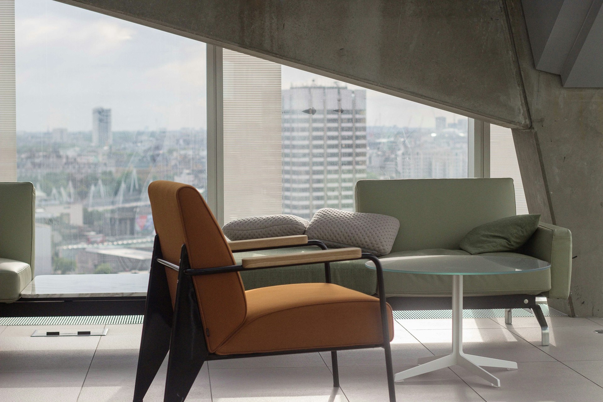 orange fabric padded armchair