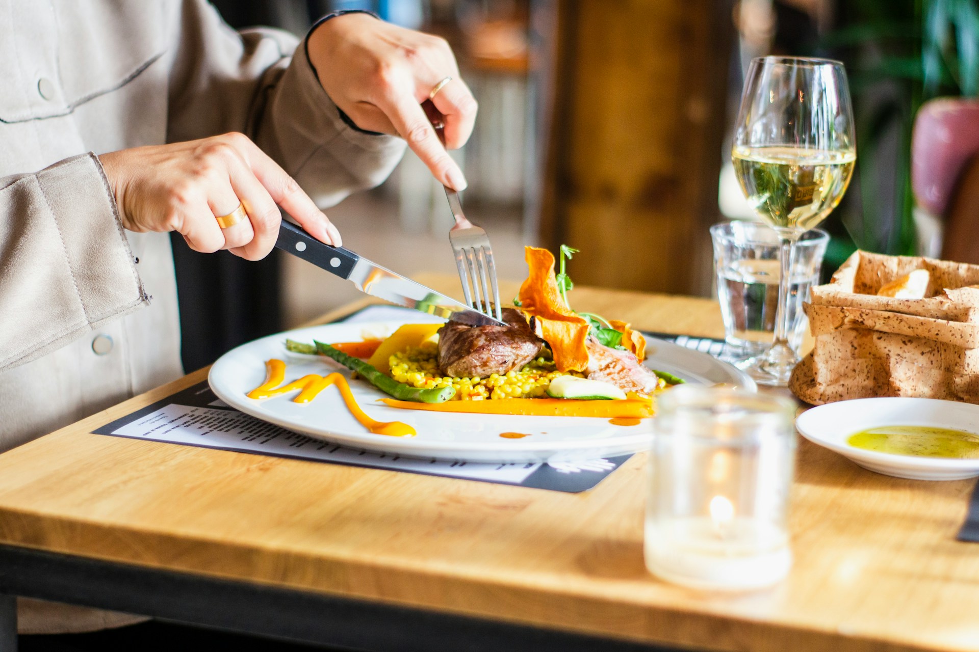 Person eating food at table