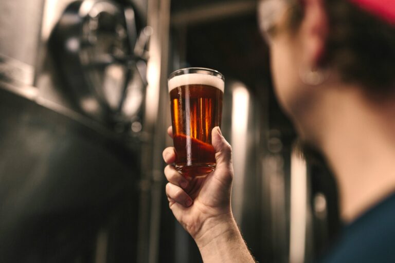 person holding a beer
