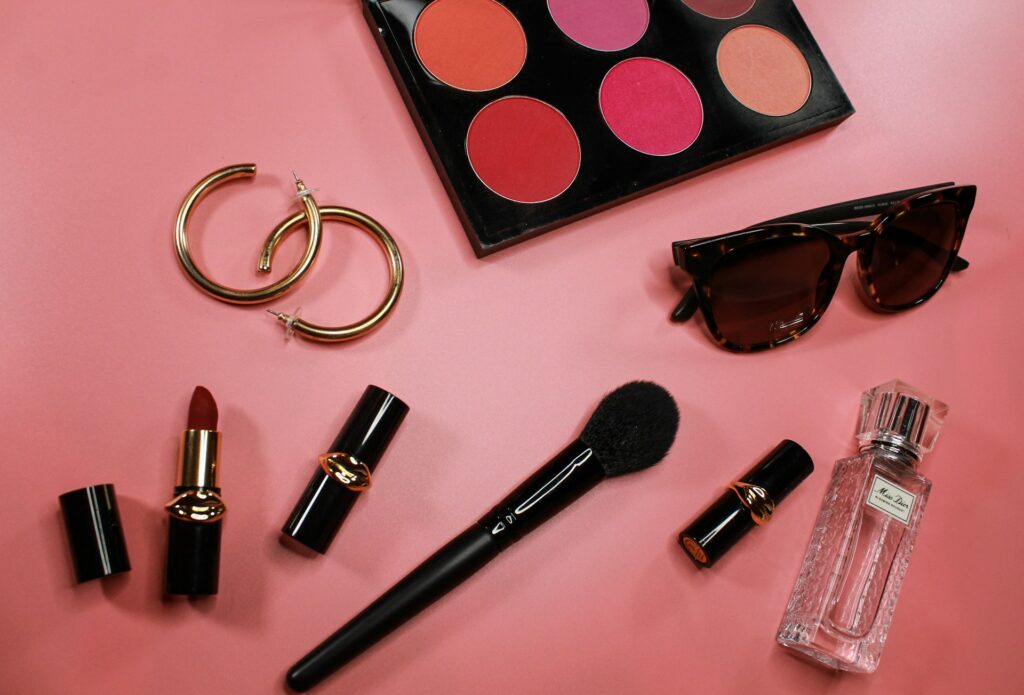 Pink and black lipstick on a tabletop