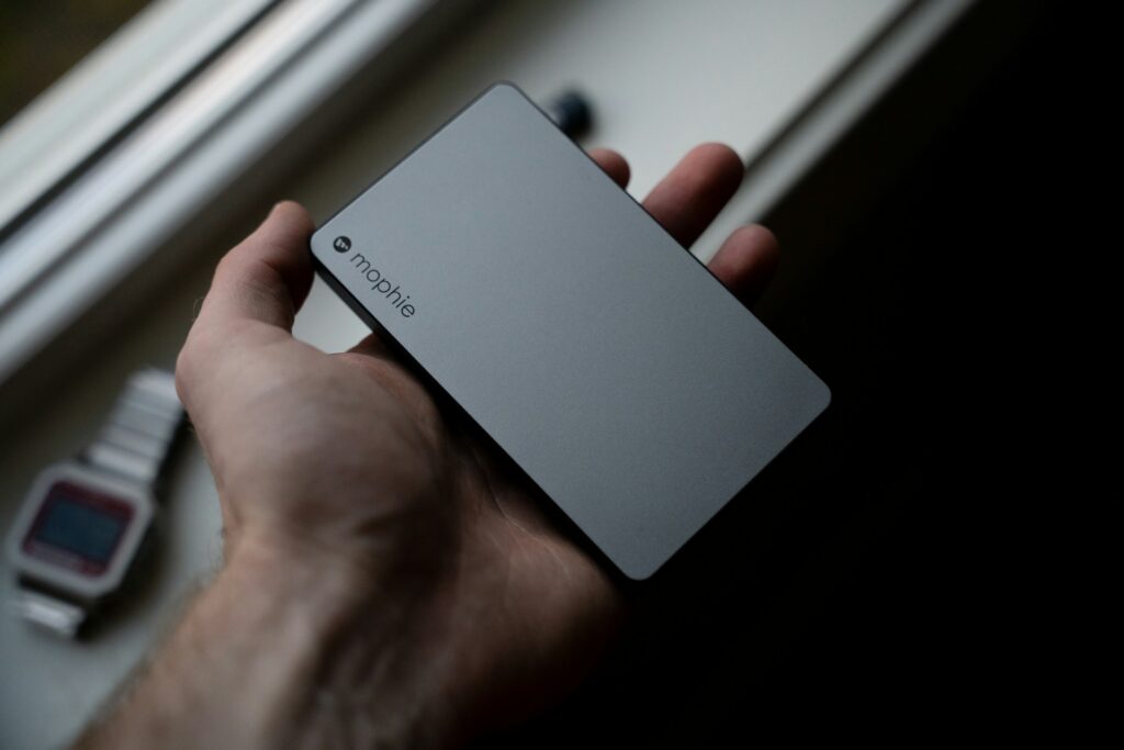 A person holding a portable charger