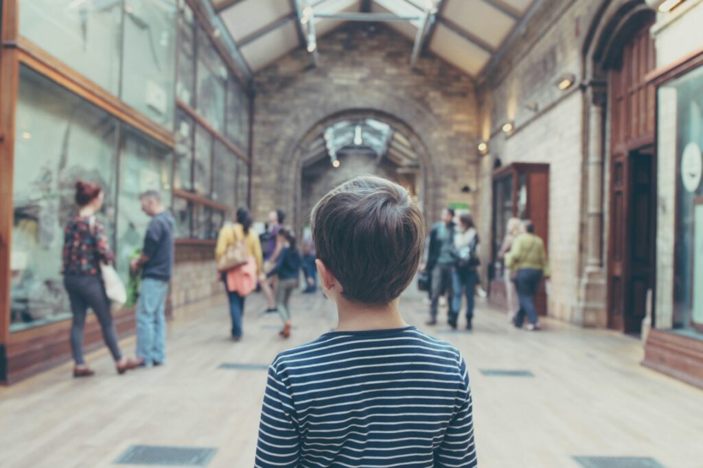 A child standing in a museum hall
