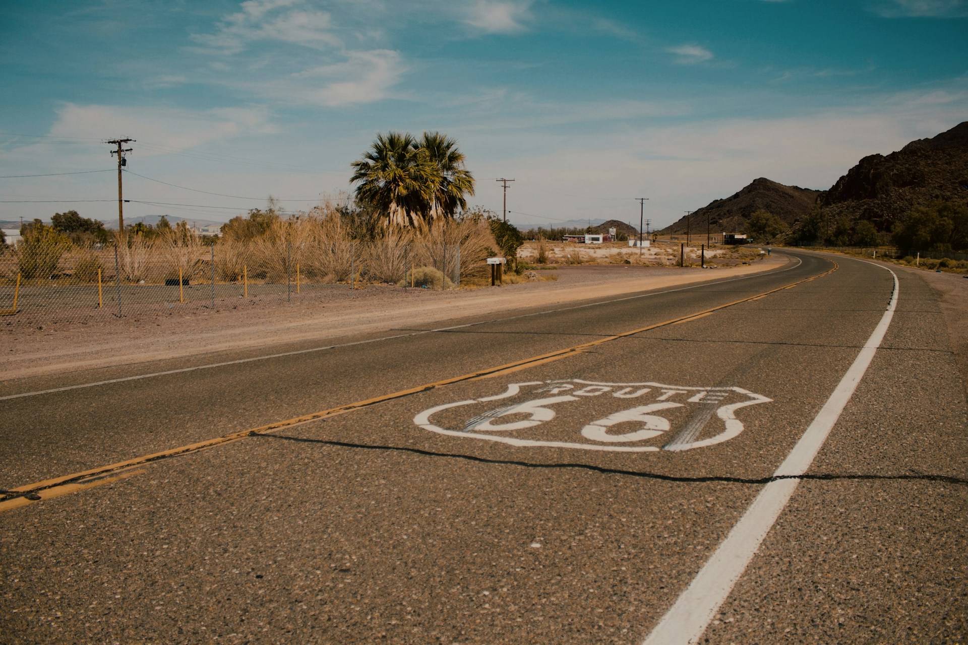 A Route 66 sign painted on the road
