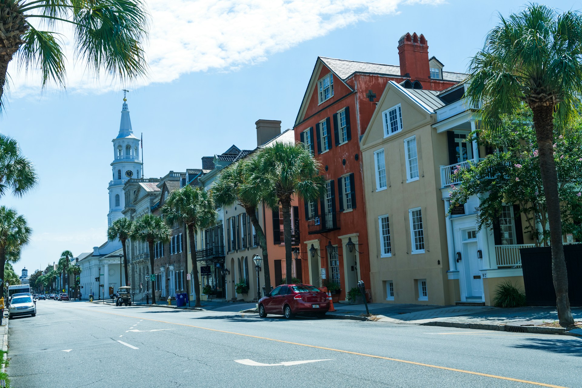 A colorful street with palm trees in Charleston